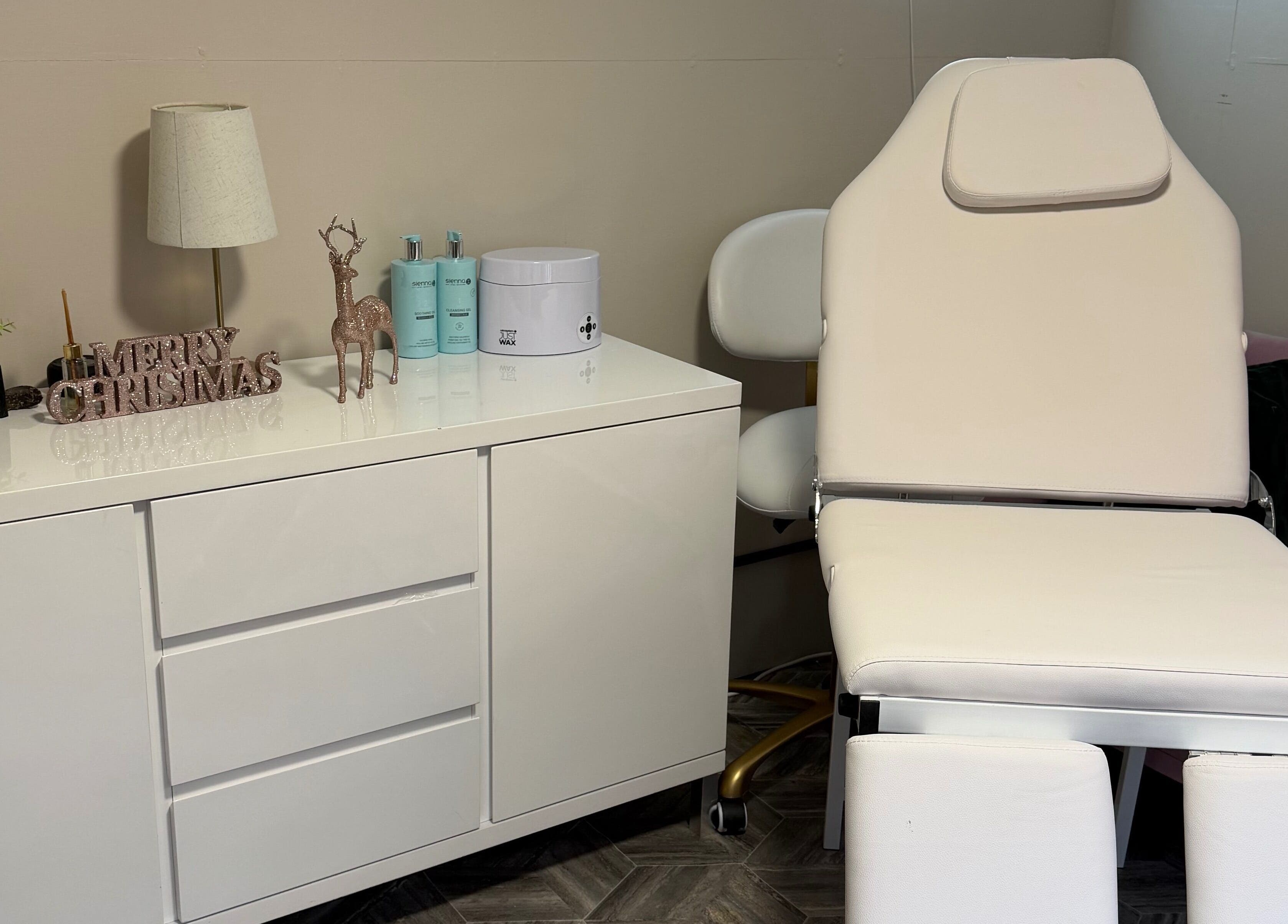 Modern treatment area at Beauty Bank in Clitheroe, England, GB with elegant decor and comfortable chair.