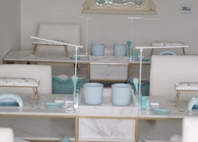 Luxurious nail stations at Shadi Nails in Conoga Park, California, US, featuring stylish white and blue decor.