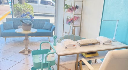 Chic and inviting nail service area at Shadi Nails in Encino, California, US, featuring modern decor and blue tones.