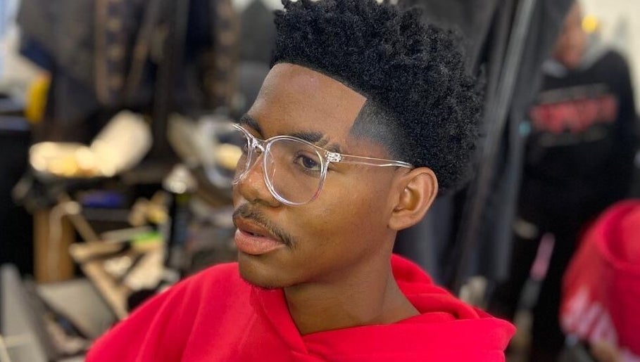 Client with trendy haircut and glasses at Friendly Salon, Soshanguve, Gauteng, ZA.