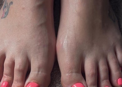 Vibrant coral pedicure at Friendly Salon, Soshanguve, Gauteng, ZA, highlighting elegant foot care.