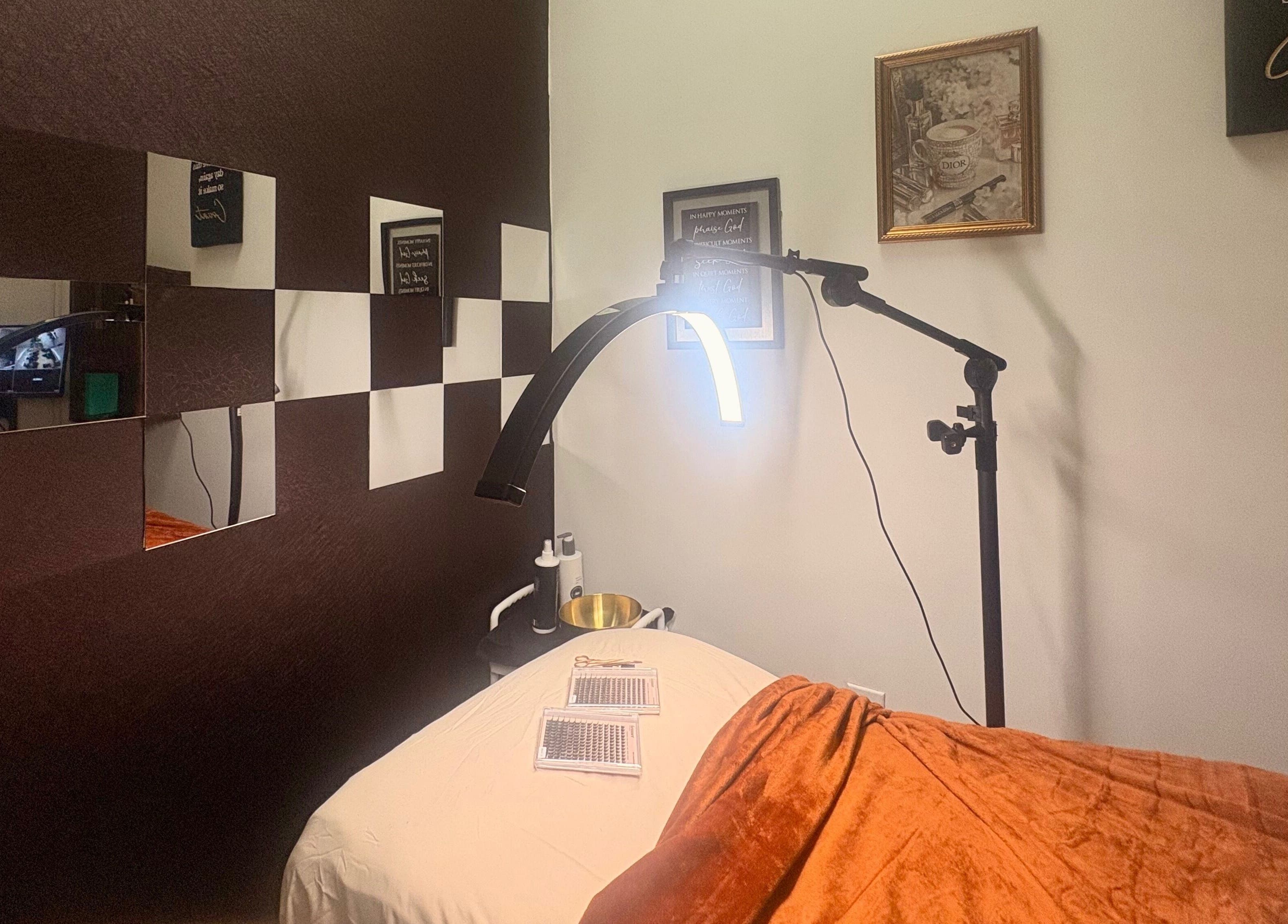 Cozy treatment room at Noire Naturels Aesthetics, Dallas, Texas, US, featuring ambient lighting and soft decor.