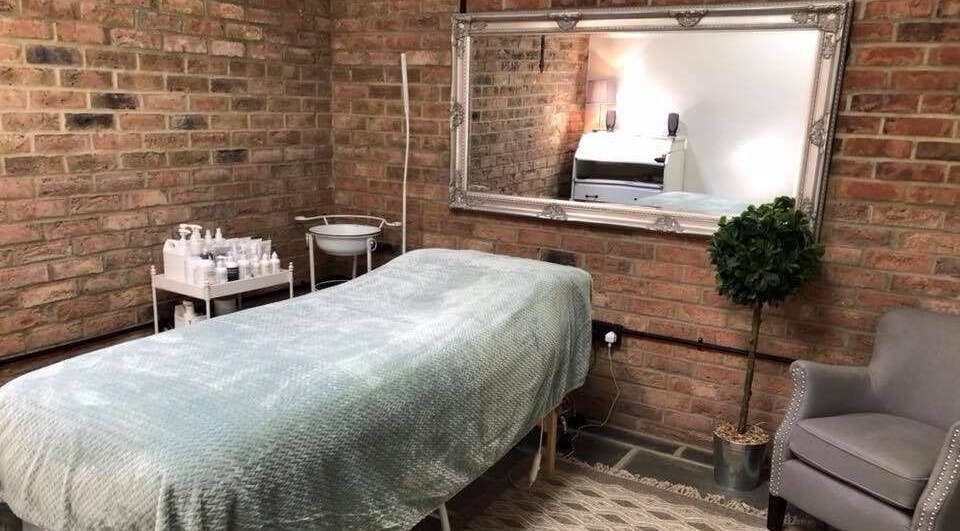 Cozy massage room at The Retreat, Oakhanger, England, GB with elegant decor and soothing ambiance.