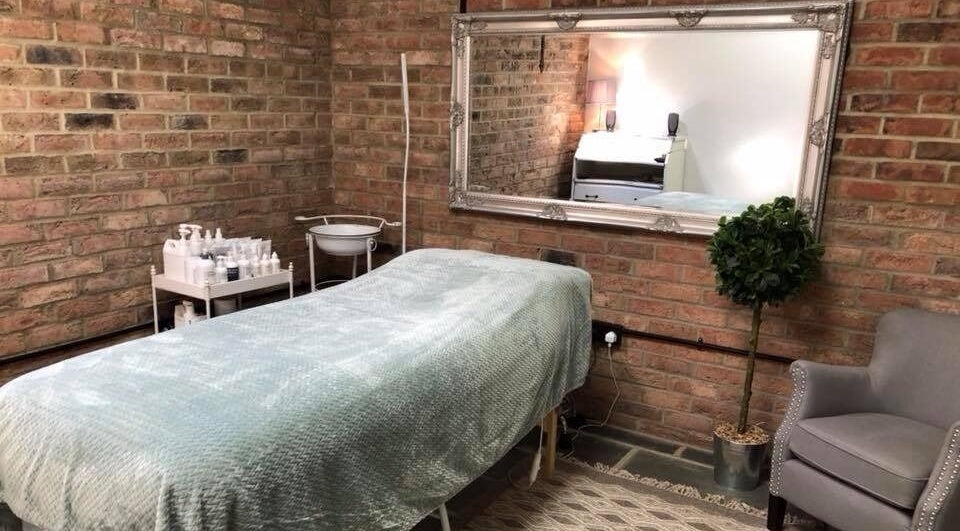 Cozy massage room at The Retreat, Oakhanger, England, GB with elegant decor and soothing ambiance.