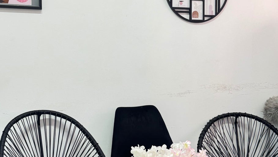 Elegant seating area with black chairs at Exotic Lash and Brow Studio, Durban, Kwazulu-Natal, ZA.