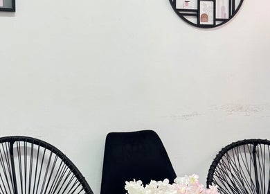 Elegant seating area with black chairs at Exotic Lash and Brow Studio, Durban, Kwazulu-Natal, ZA.