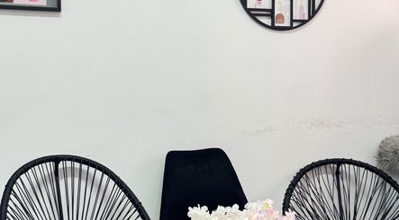 Elegant seating area with black chairs at Exotic Lash and Brow Studio, Durban, Kwazulu-Natal, ZA.