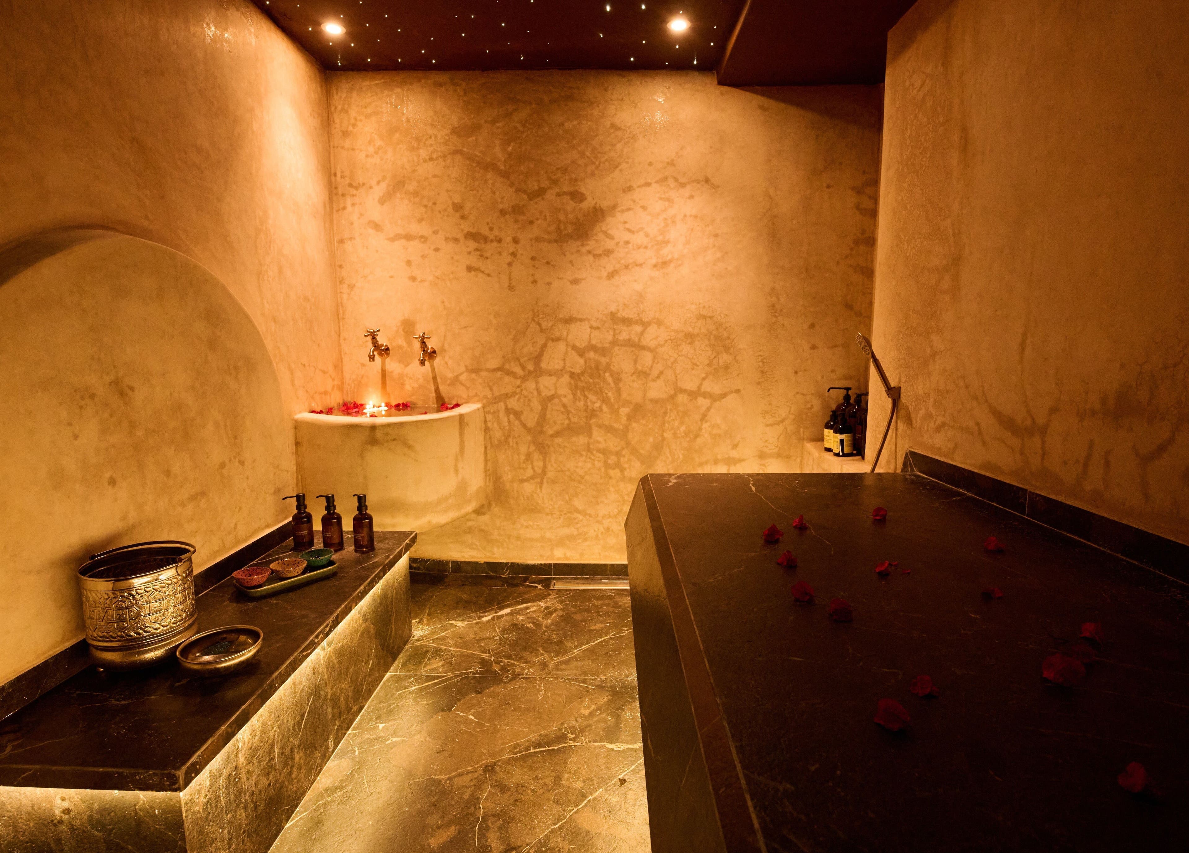 Luxurious spa room at Lalo Beauty, Casablanca, showcasing elegant Moroccan decor and relaxing ambiance.