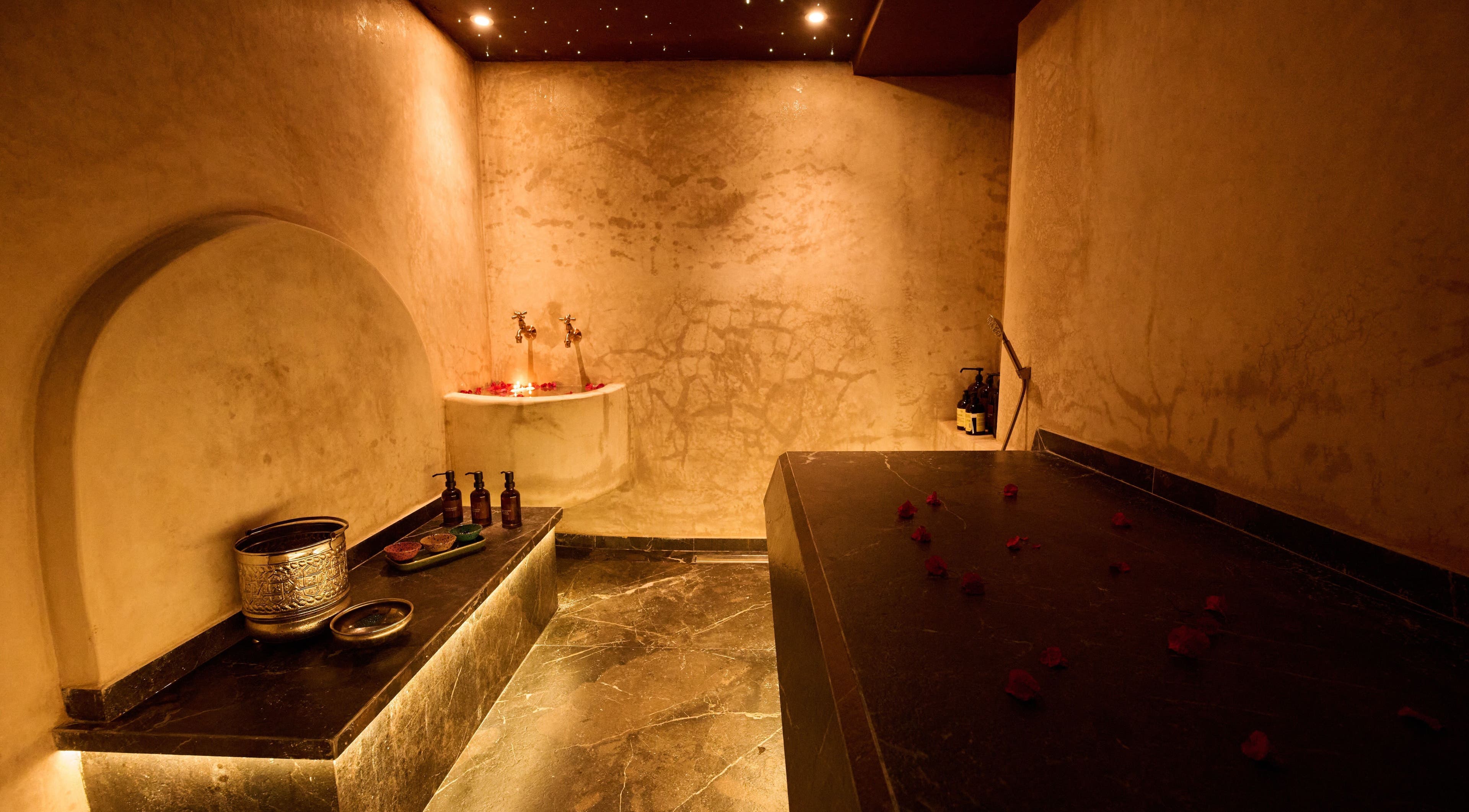Luxurious spa room at Lalo Beauty, Casablanca, showcasing elegant Moroccan decor and relaxing ambiance.