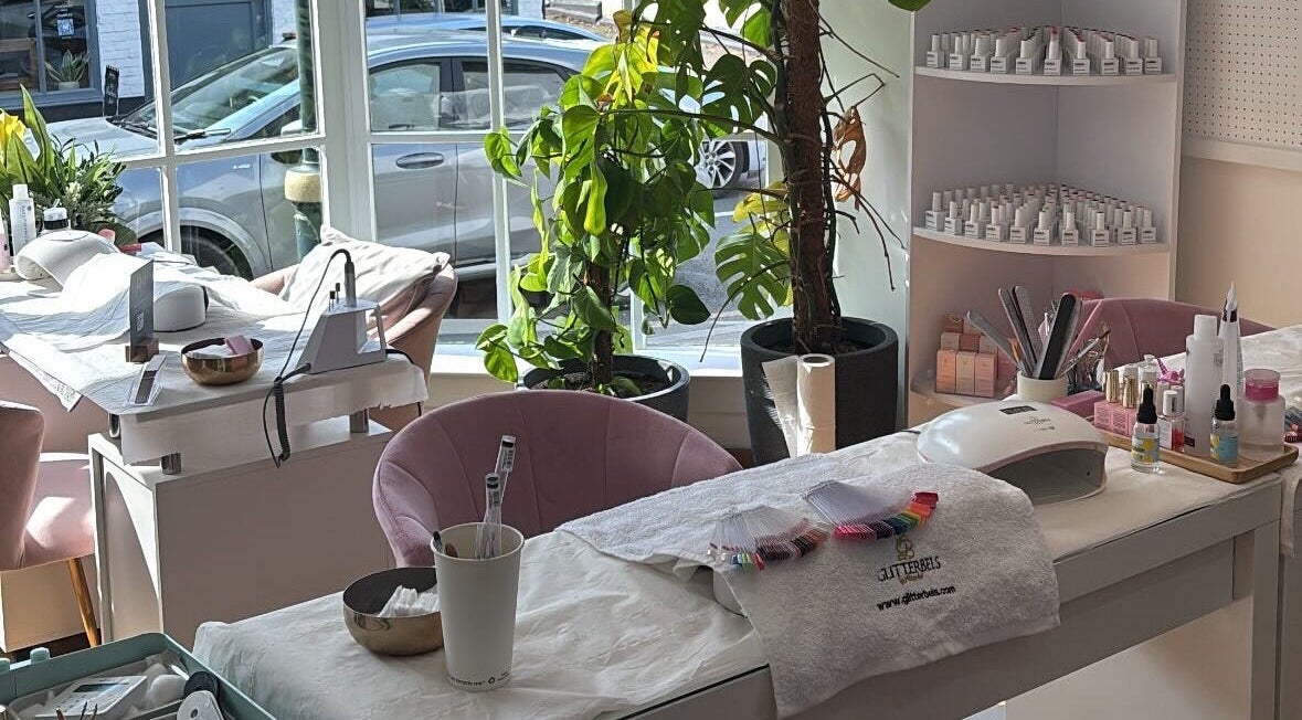 Bright nail salon setup at Glow Up With Molly in Wheathampstead, England, GB, showcasing manicure essentials.