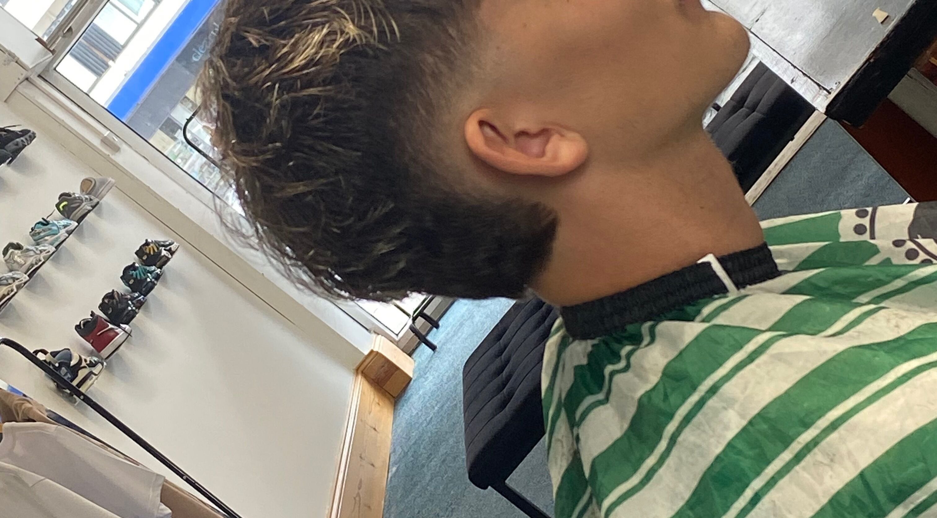 Close-up of a fresh haircut at crainerscutz, Ramsey, Ramsey, IM. Modern style in a chic venue.