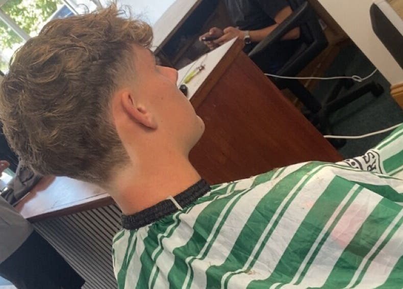 Back view of a haircut at crainerscutz in Ramsey, Ramsey, IM. Trendy and modern hairstyle showcased.