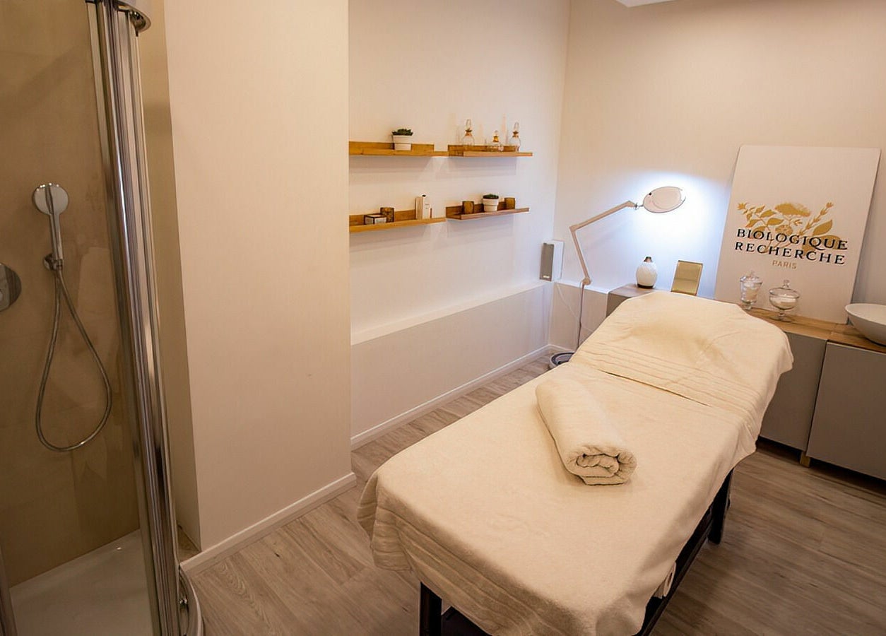 Relaxing treatment room at Studio 44 On Madison, Gibraltar, GI with massage bed and soothing decor.