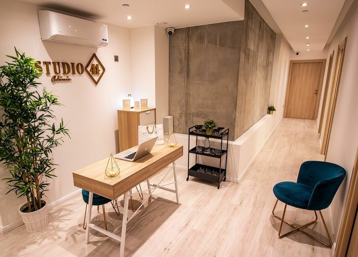 Elegant reception at Studio 44 On Madison, Gibraltar, GI featuring stylish decor and chic seating.