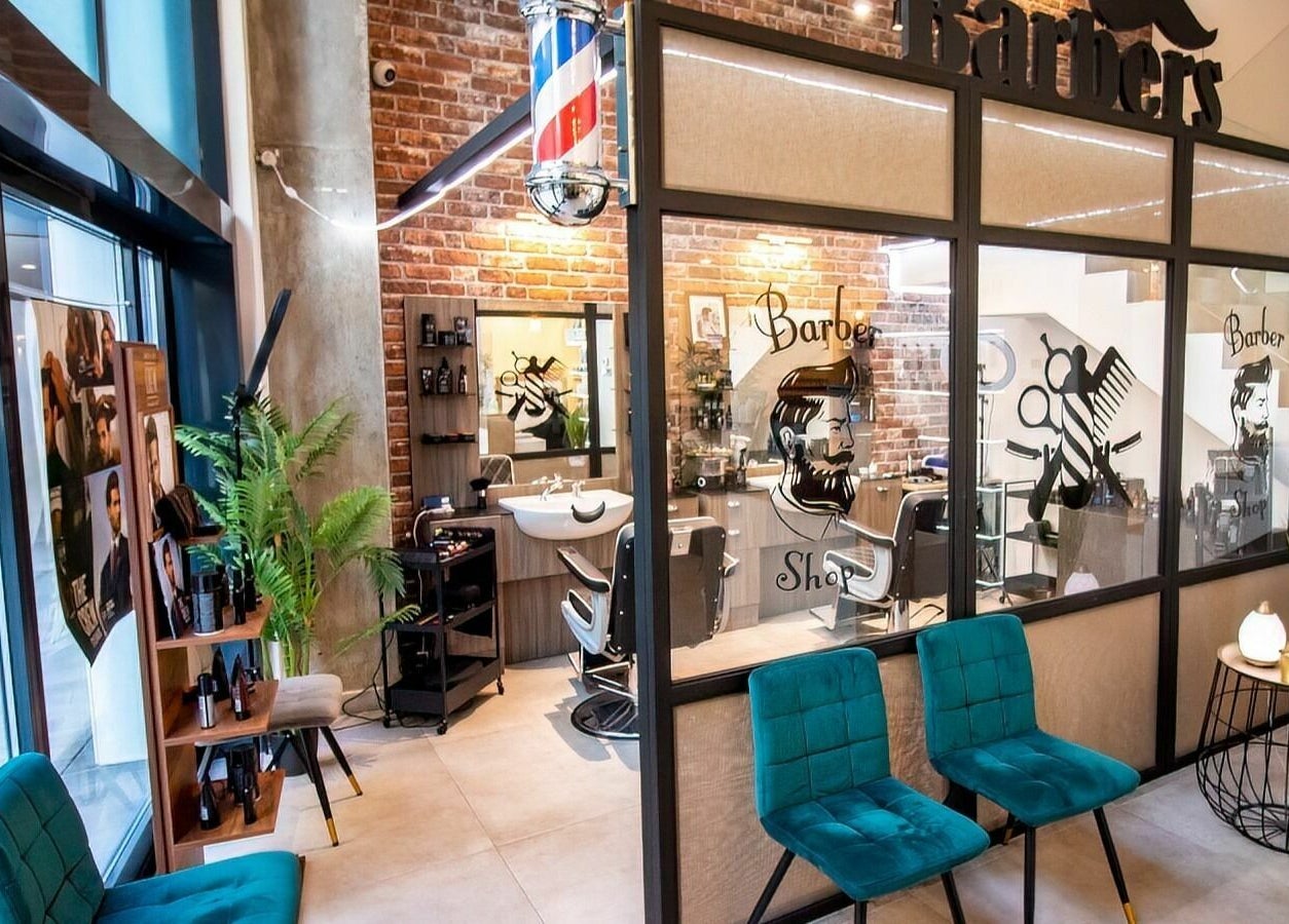 Modern barber shop at Studio 44 On Madison in Gibraltar, GI with stylish decor and sleek seating.