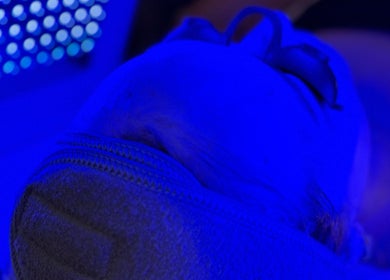 Blue LED therapy session at Revive Skin Studio, San Jose, California, US, enhancing skin rejuvenation.