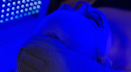 Blue LED therapy session at Revive Skin Studio, San Jose, California, US, enhancing skin rejuvenation.