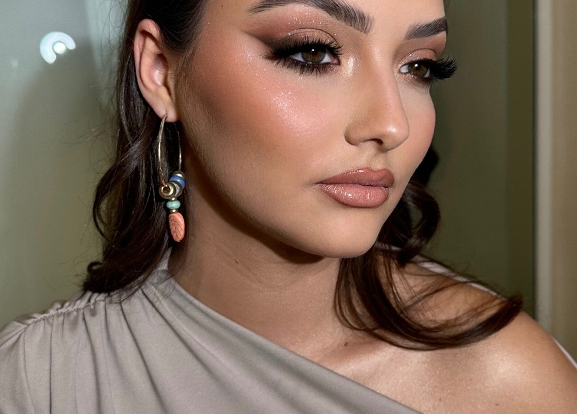 Close-up of elegant makeup at Aria Beauty in Enfield, England, GB, showcasing subtle glam and chic earrings.