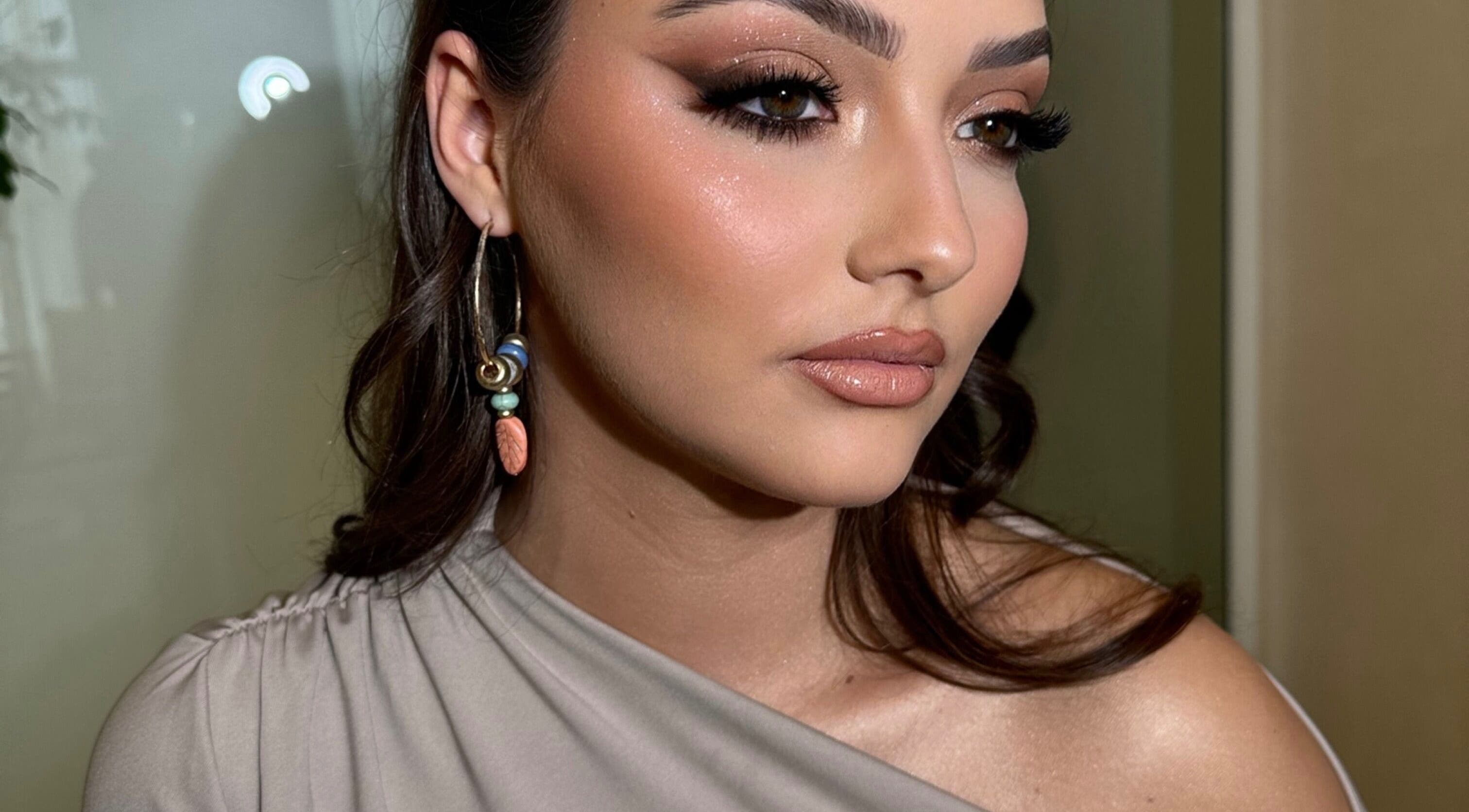 Close-up of elegant makeup at Aria Beauty in Enfield, England, GB, showcasing subtle glam and chic earrings.