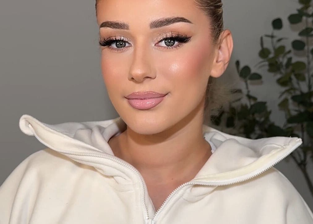 A person with flawless makeup from Aria Beauty, located in Enfield, England, GB.