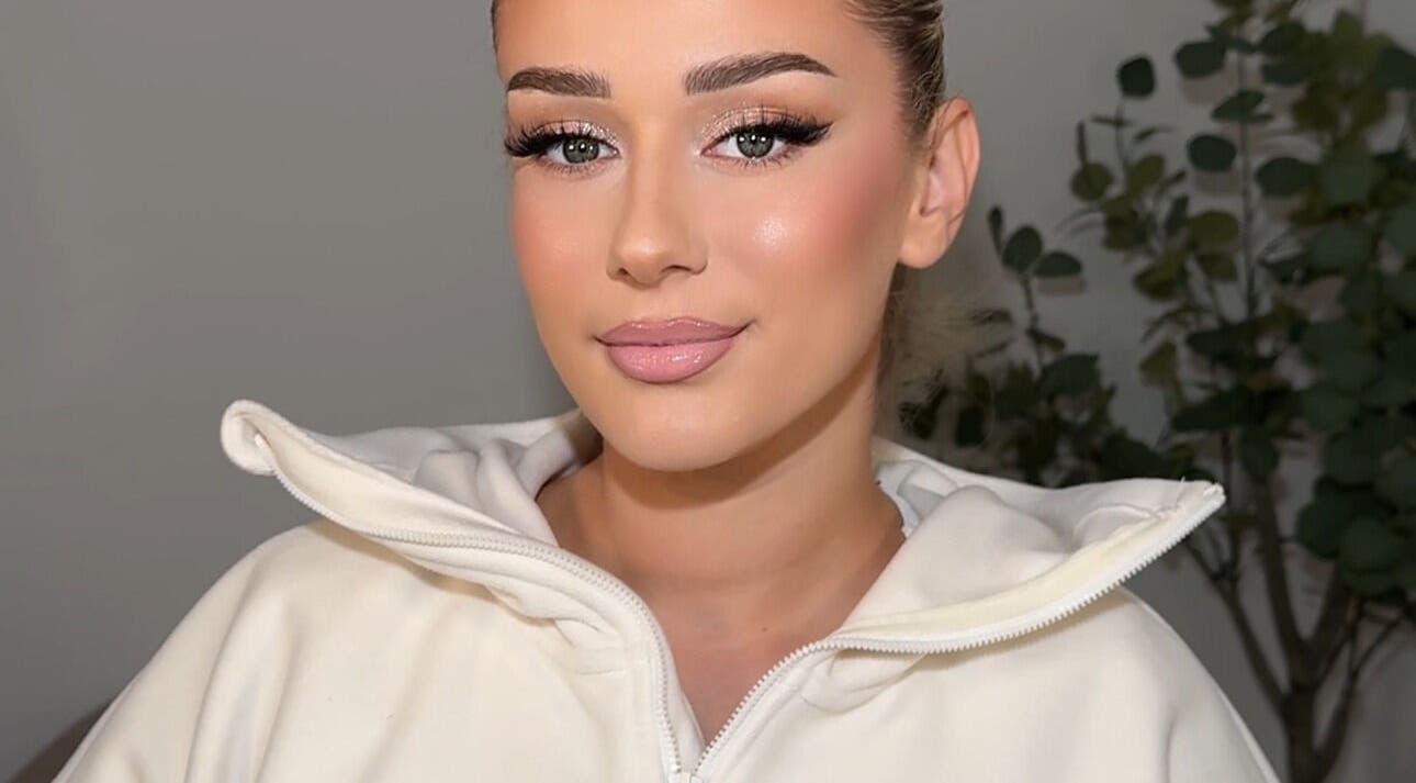 A person with flawless makeup from Aria Beauty, located in Enfield, England, GB.