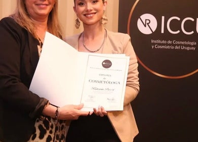 Graduate receives cosmetology diploma at K Beauty Studio, Maldonado, Departamento De Maldonado, UY.