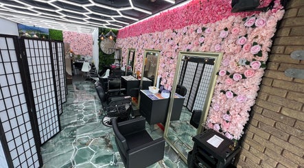 Stylish interior of Lady's Lux Beauty in Salford, England, with floral decor and sleek design.