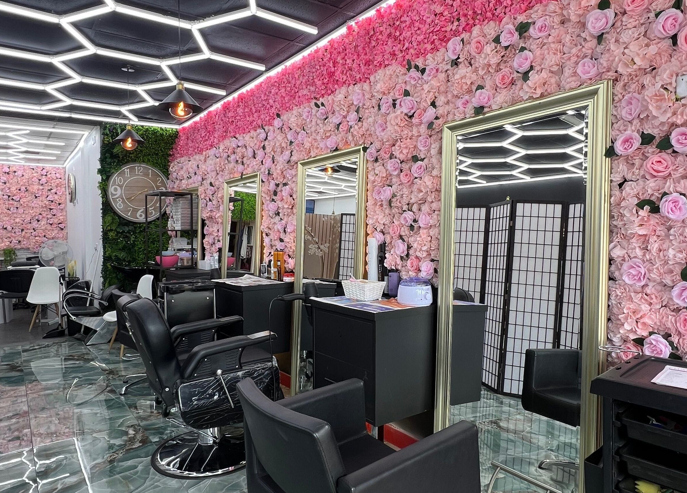 Lady’s Lux Beauty salon with floral walls and stylish chairs in Salford, England, GB.