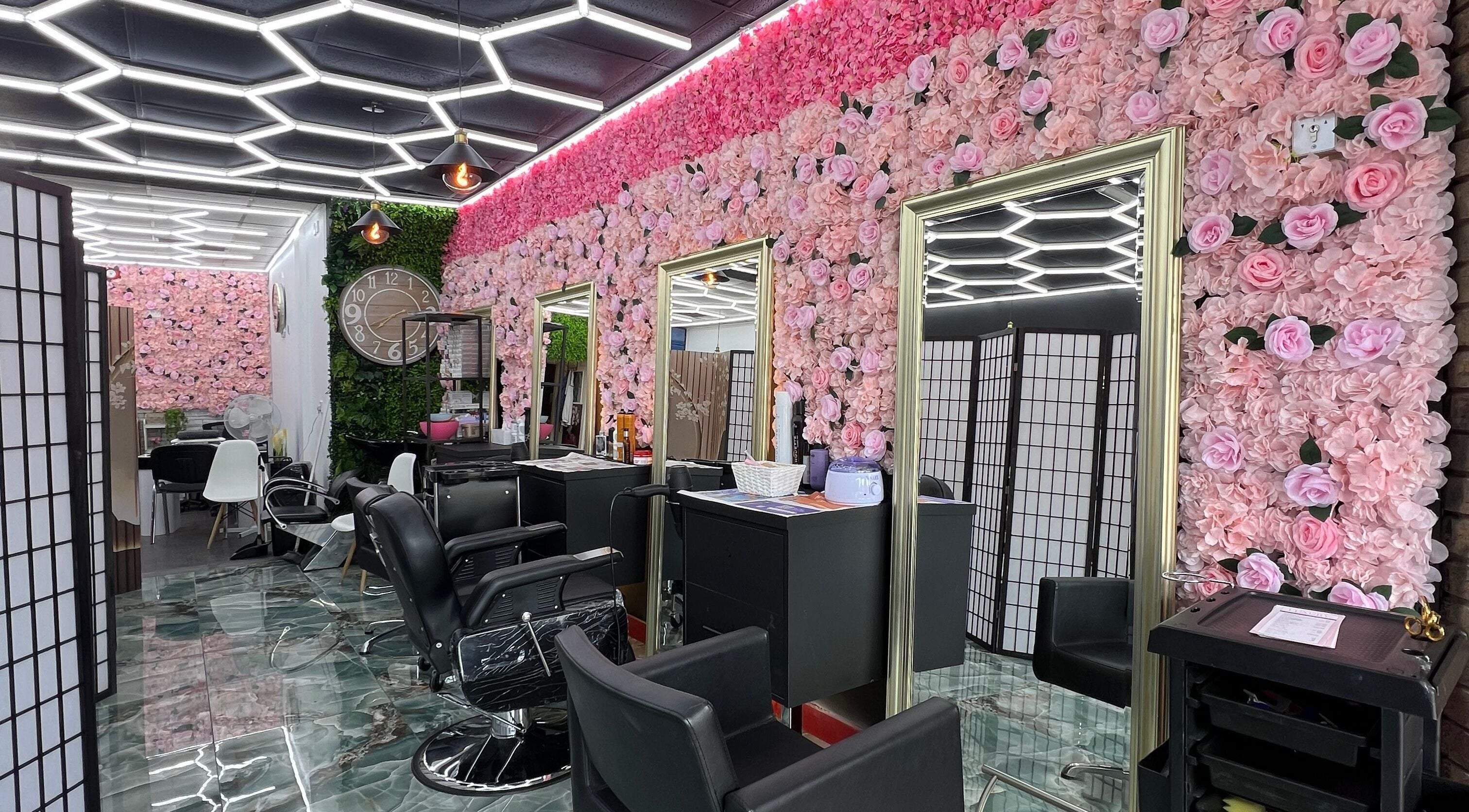 Lady’s Lux Beauty salon with floral walls and stylish chairs in Salford, England, GB.