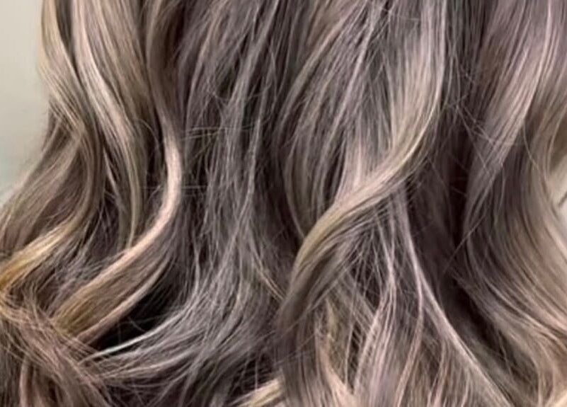 Elegant wavy hairstyle at Lady’s Lux Beauty, Salford, England, GB.