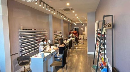 Interior of Westboro Infinity Nails in Ottawa, Ontario, CA, showcasing manicure stations and polish displays.