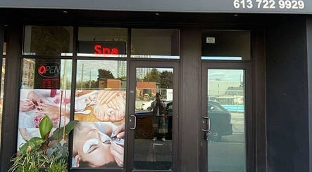 Exterior of Westboro Infinity Nails, Ottawa, Ontario, CA with spa signage and greenery.