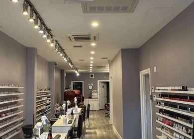 Interior of Westboro Infinity Nails in Ottawa, Ontario, CA, showcasing nail polish display and chic decor.