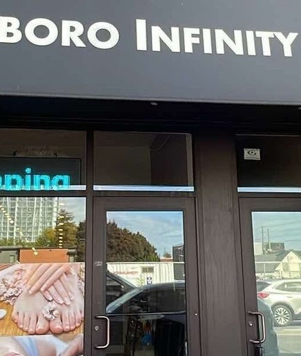 Entrance of Westboro Infinity Nails, Ottawa, Ontario, CA, with signage and glass doors.