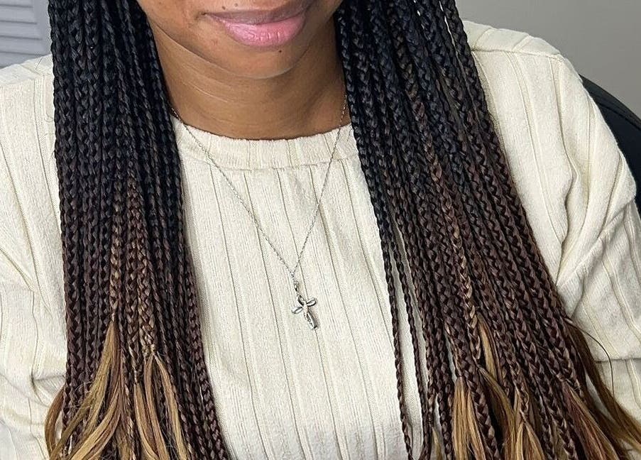 Beautiful braided hairstyle at Skin Knead Beauty in Nassau, New Providence, BS.