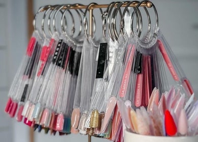 Colorful nail polish samples on display at Artisa Studio, Maule, Maule, CL, showcasing diverse shades.