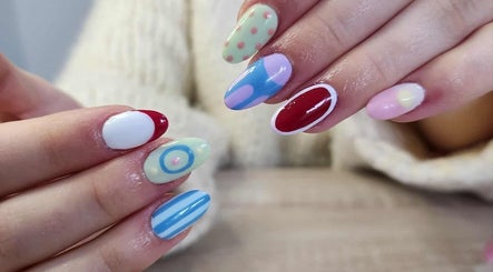 Vibrant nail art at Velvet Beauty Salon, Wellington, NZ showcasing intricate designs and bold colors.