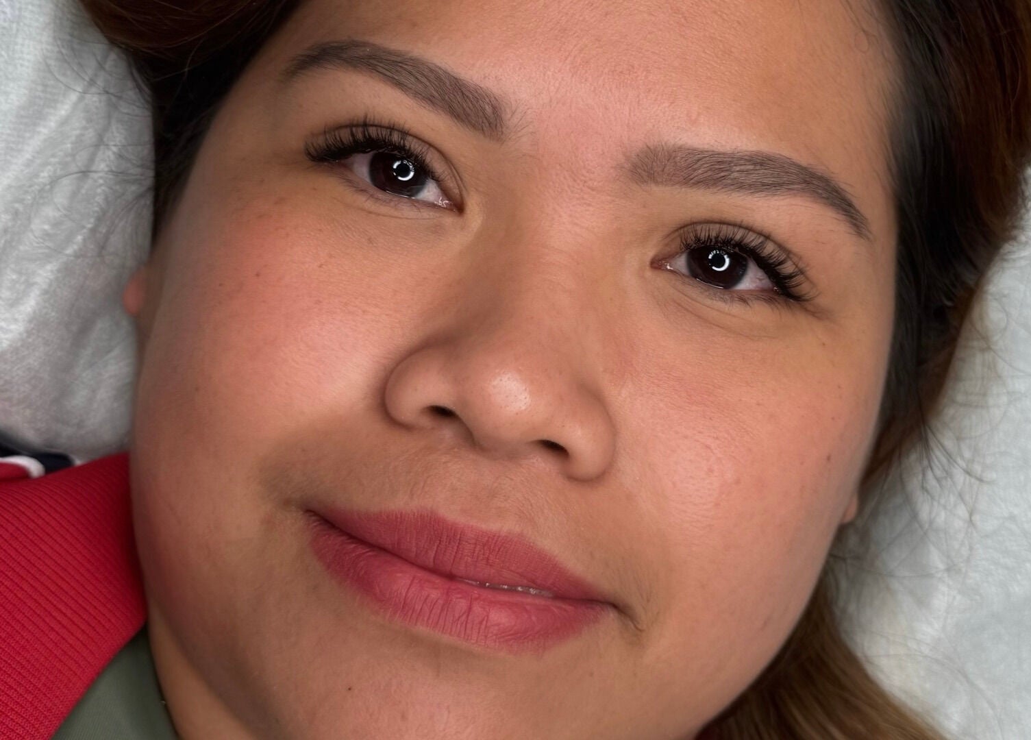 A client with radiant skin after a facial treatment at Touched by Aljoy, Hammond Park, Western Australia, AU.