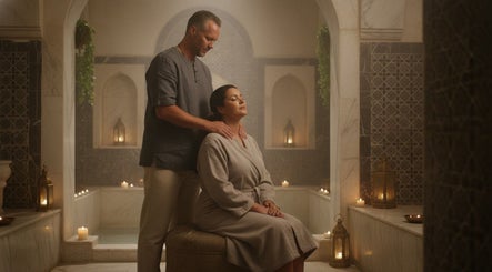 Relaxing massage at CreteSecretTouch Agios Nikolaos spa, Agios Nikolaos, GR in a serene, candle-lit room.