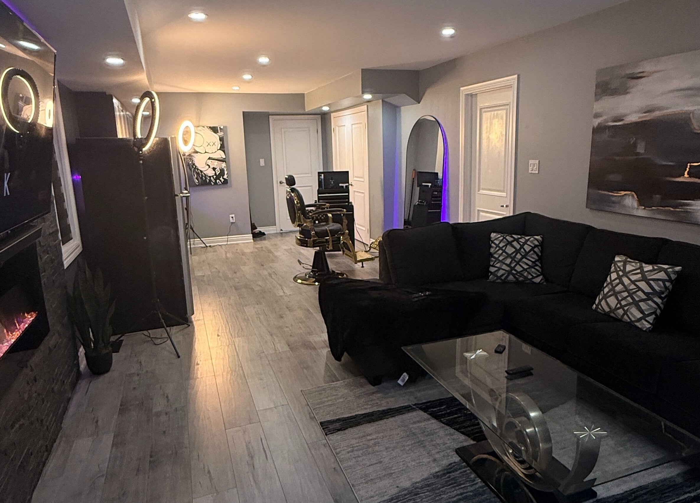 Luxurious barber setup at Blends by DAZE in Brampton, Ontario, CA. Modern decor with a plush black sofa.