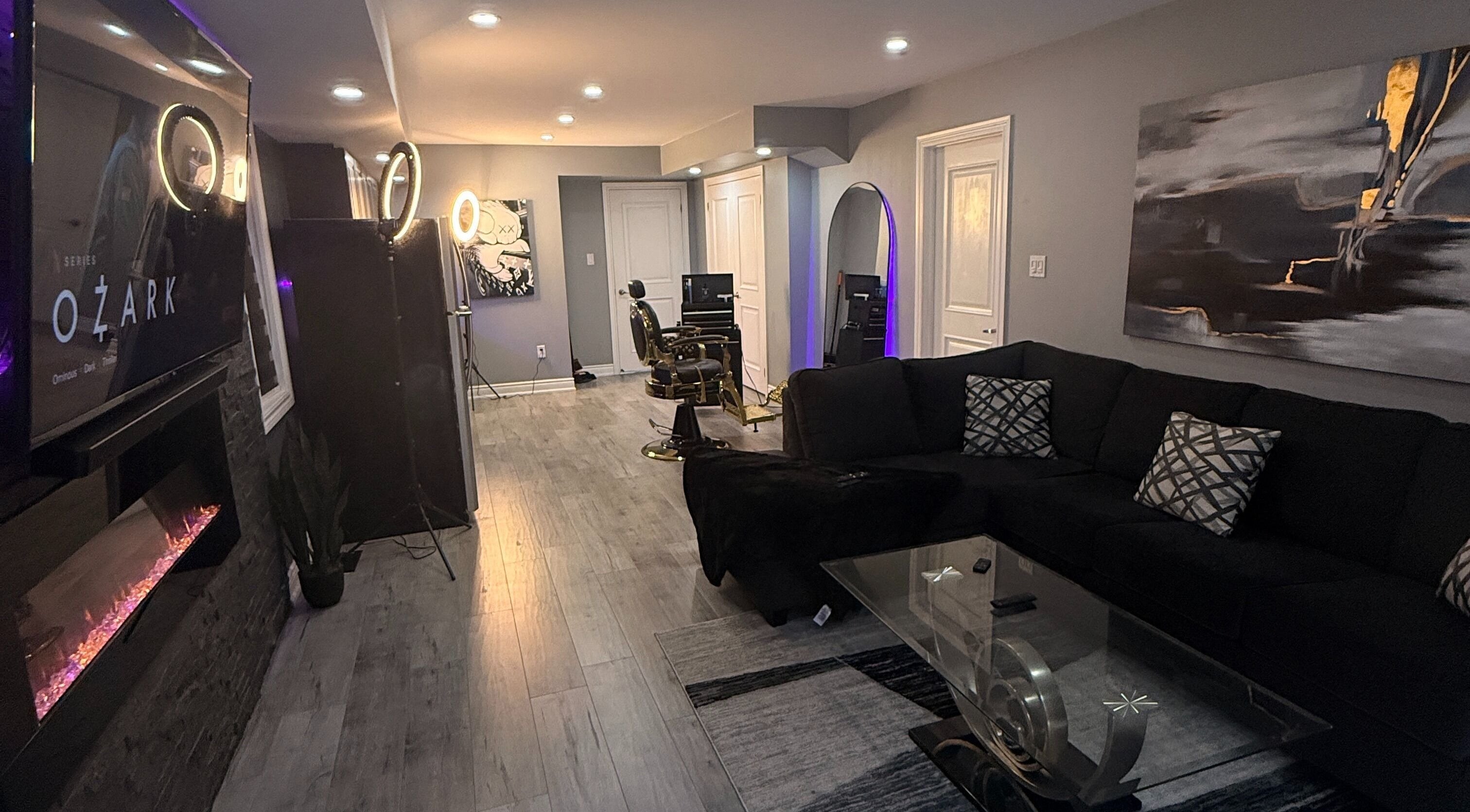 Luxurious barber setup at Blends by DAZE in Brampton, Ontario, CA. Modern decor with a plush black sofa.