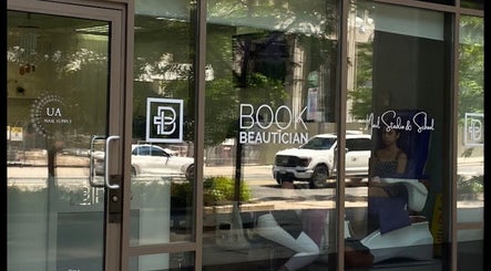 Entrance of a beauty venue with glass doors in Toronto, Ontario, CA, showcasing NYRELLI Skin + Laser.