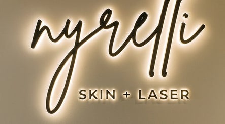 Nyrelli Skin + Laser glowing sign in Toronto, Ontario, CA; modern beauty venue branding.