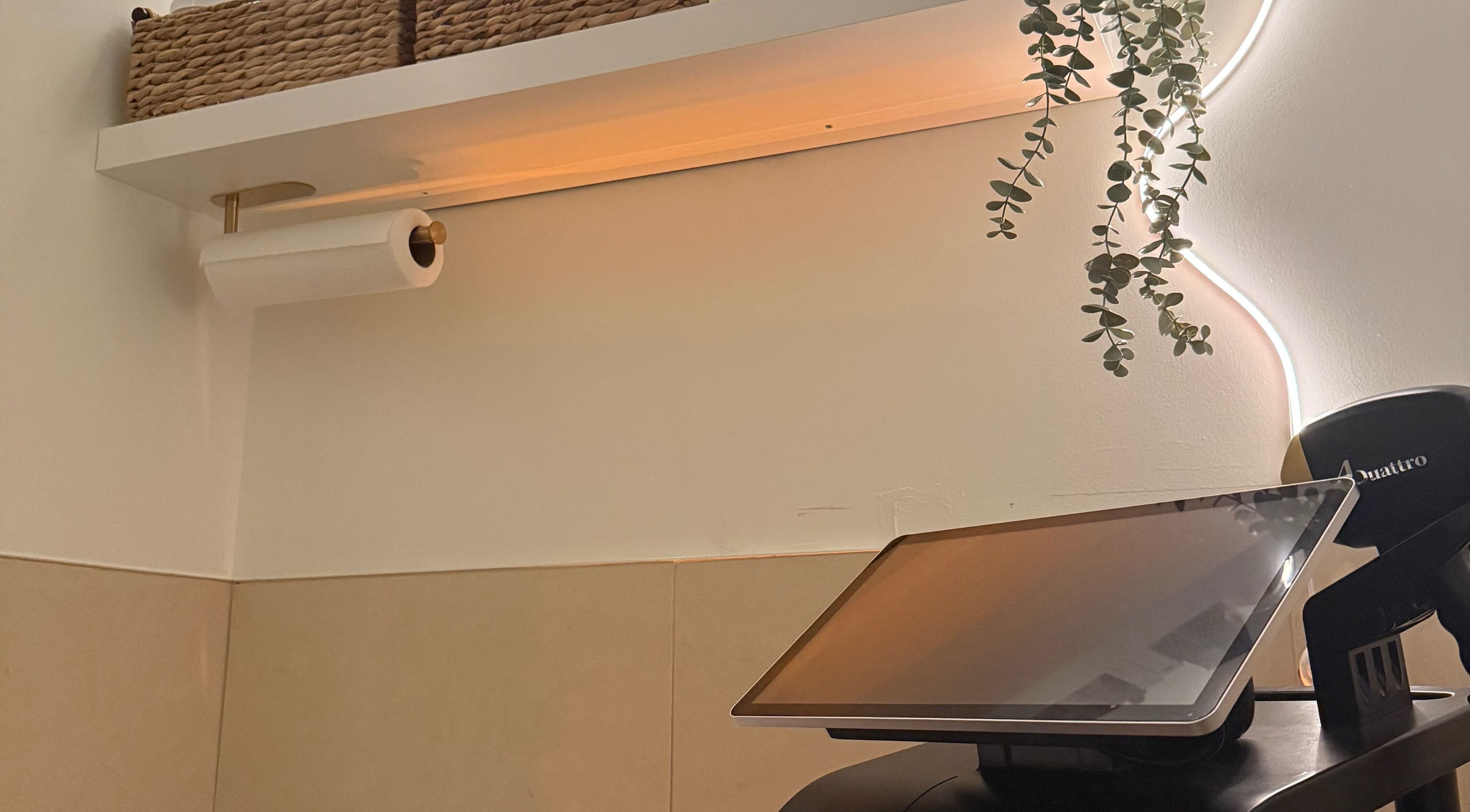 Peaceful workspace with tablet at Nyrelli Skin + Laser, Toronto, Ontario, CA. Modern decor enhances wellness ambience.