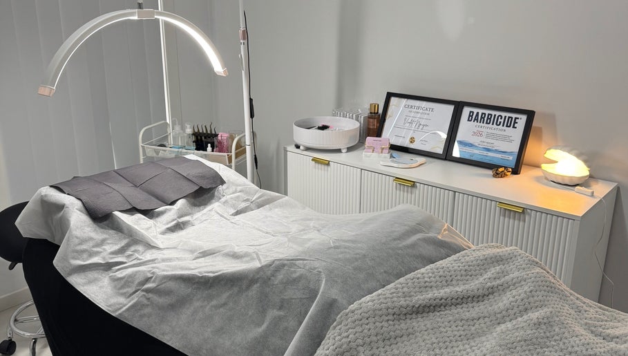 Cozy treatment room at Lashesbyvioletn in Elizabeth Hills, New South Wales, AU, with spa bed and certificates.