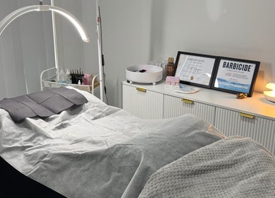 Cozy treatment room at Lashesbyvioletn in Elizabeth Hills, New South Wales, AU, with spa bed and certificates.