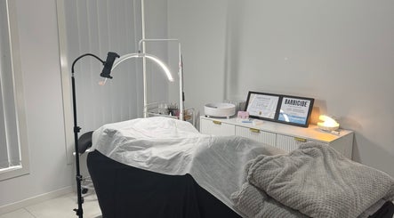 Treatment room at Lashesbyvioletn in Elizabeth Hills, New South Wales, AU, featuring a serene setup.