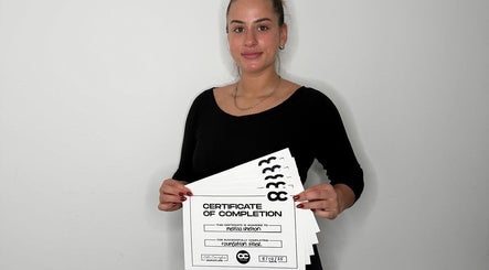 Proud graduate with certificates at Melted Perfections, Billericay, England, GB.
