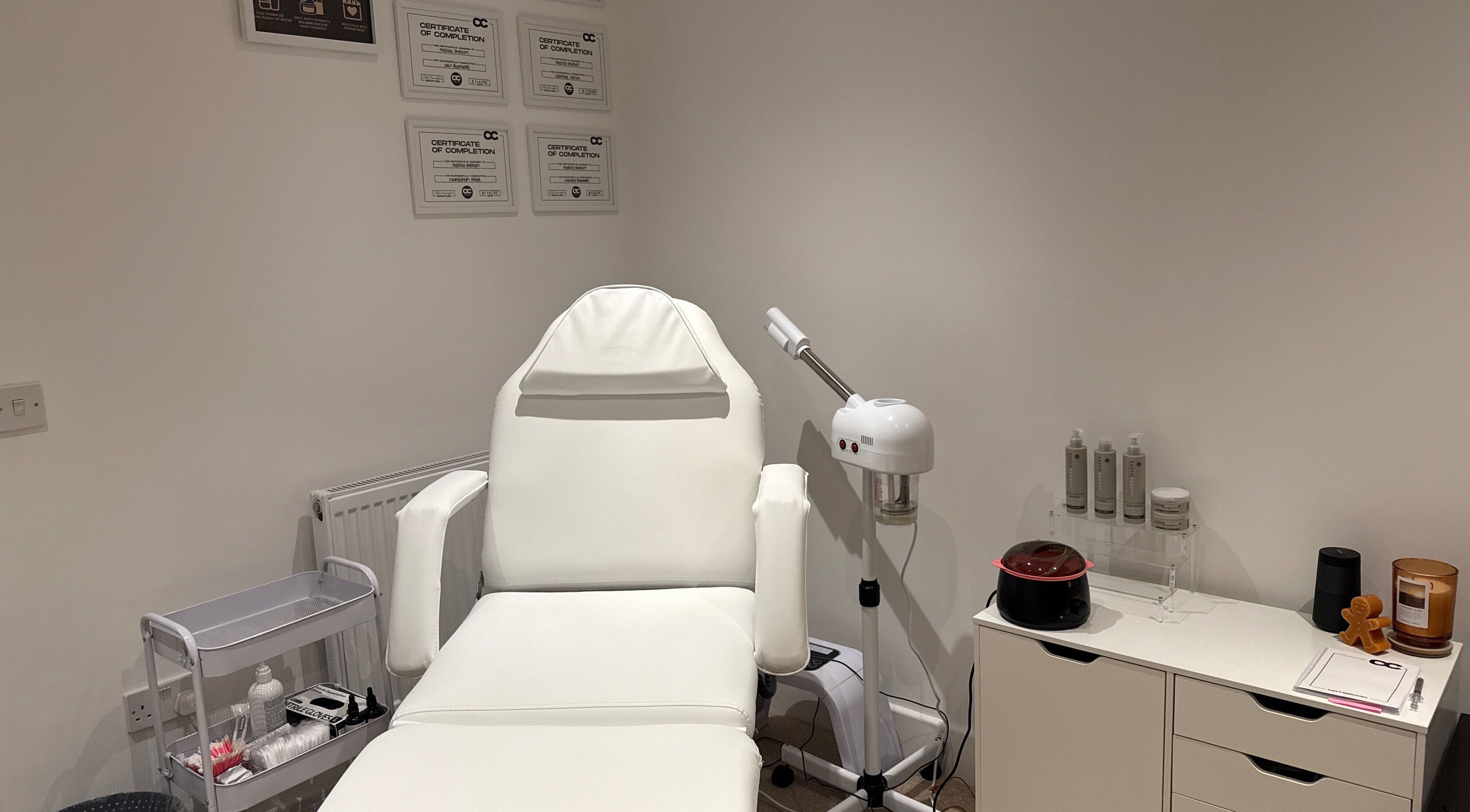 Melted Perfections spa room in Billericay, England, showcasing a treatment chair and equipment.