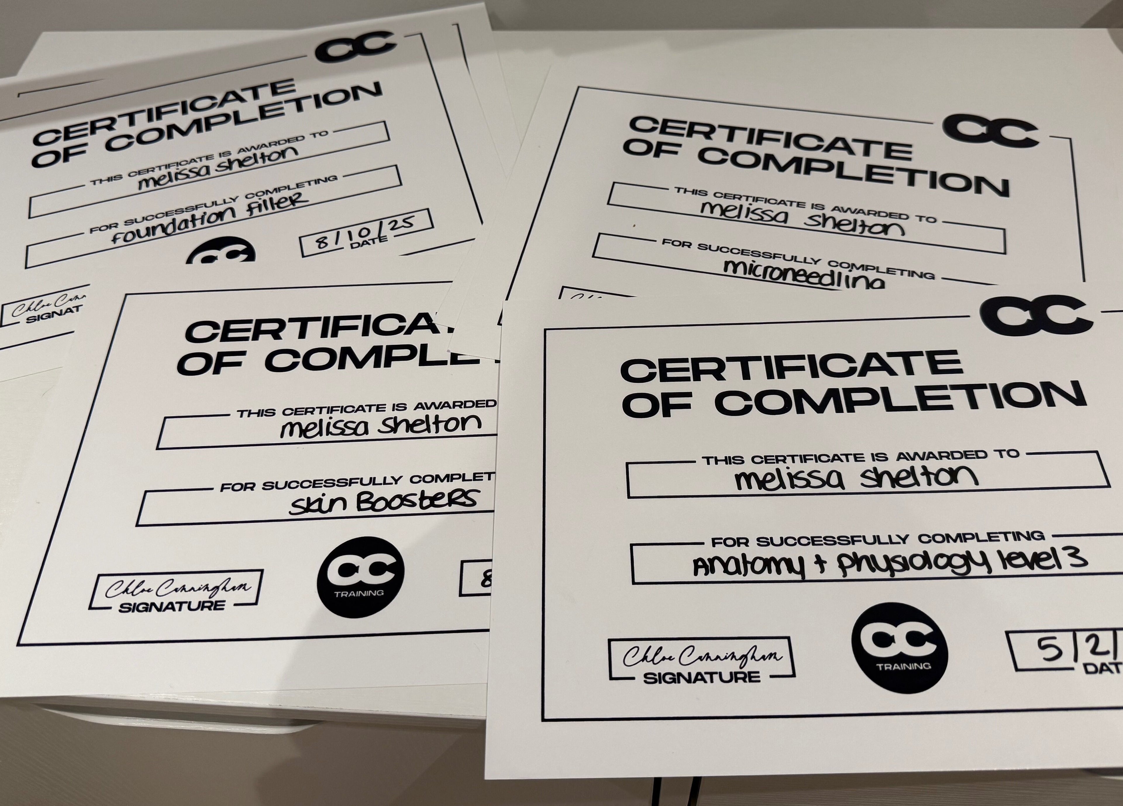 Certificates showcasing training completion at Melted Perfections, Billericay, England, GB.